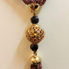 particolare collana granato peridoto jolite